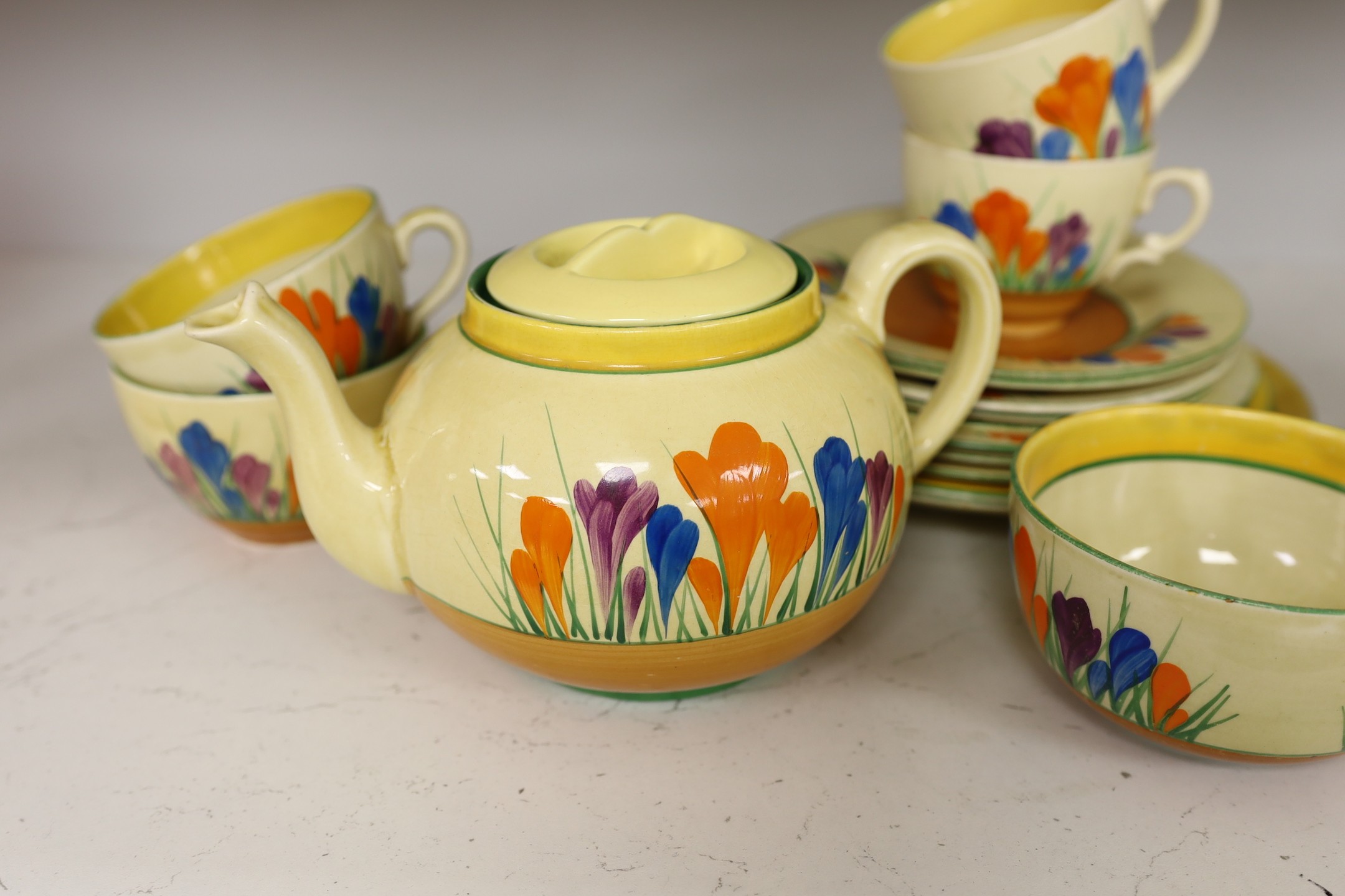 A group of Clarice Cliff crocus pattern tea wares, teapot 22 cm across